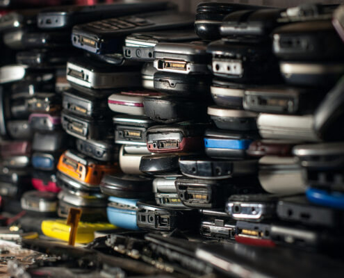 outdated and old cell phones staked