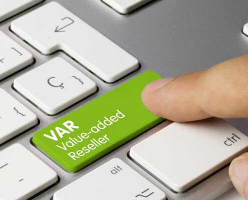 Silver metal Apple keyboard with green button with VAR Value-added Reseller text instead of shift